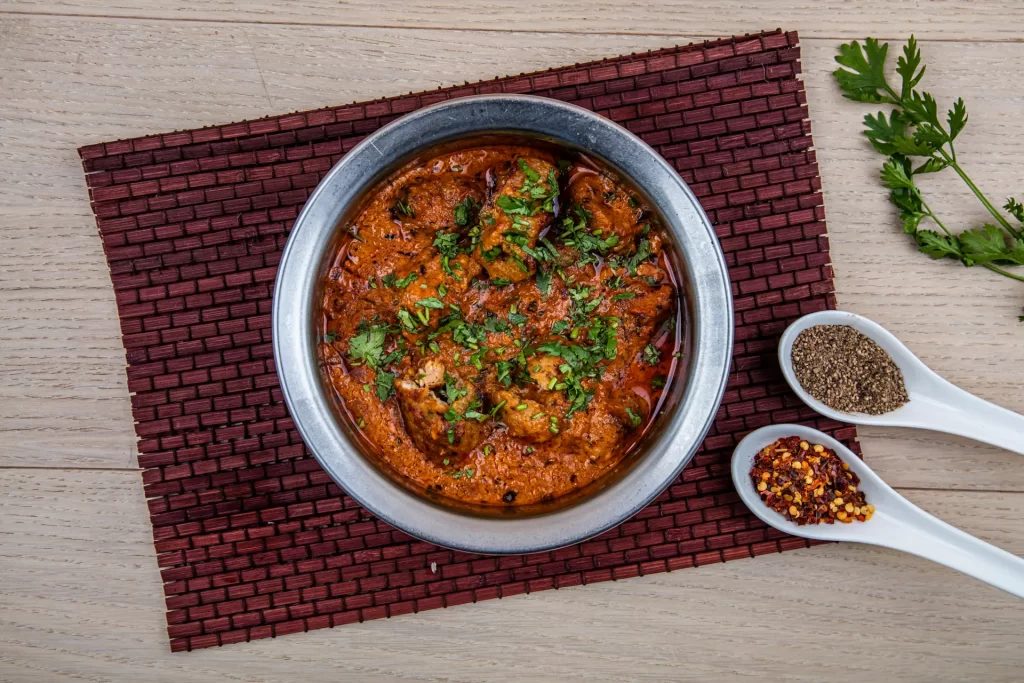 Bowl of kebab handi, a stew with chicken, vegetables, and spices.