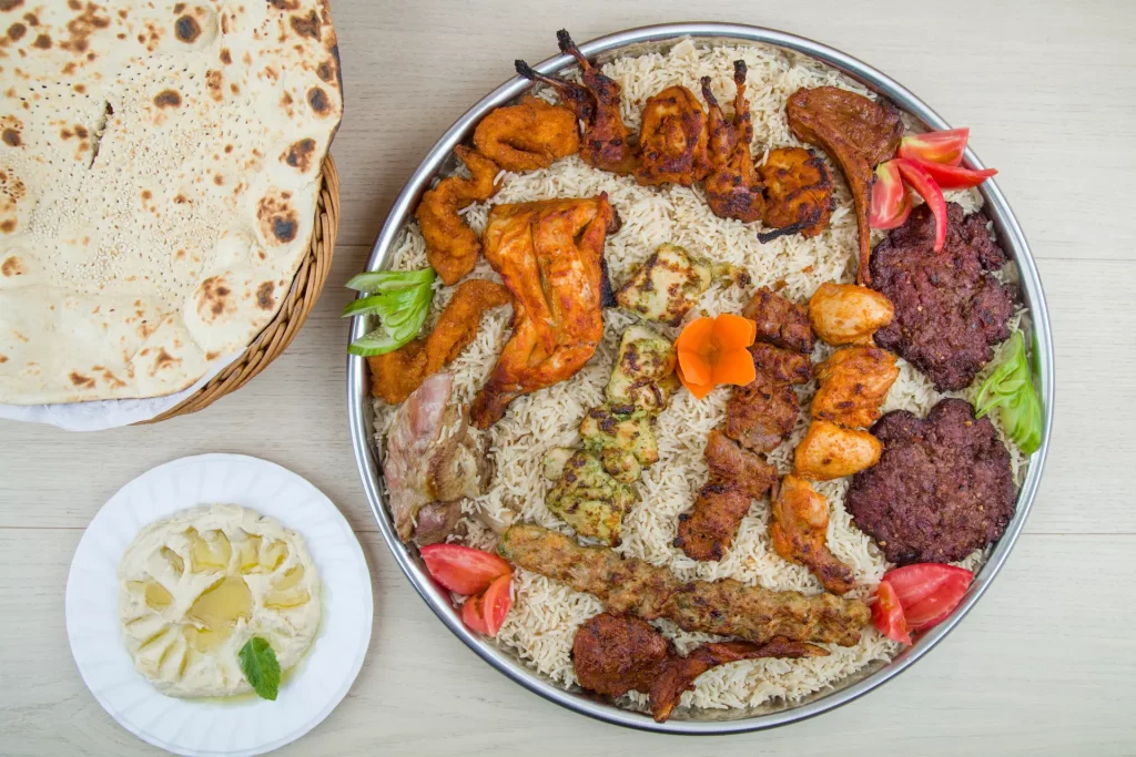 A Kandhari platter with rice, meat, and vegetables.